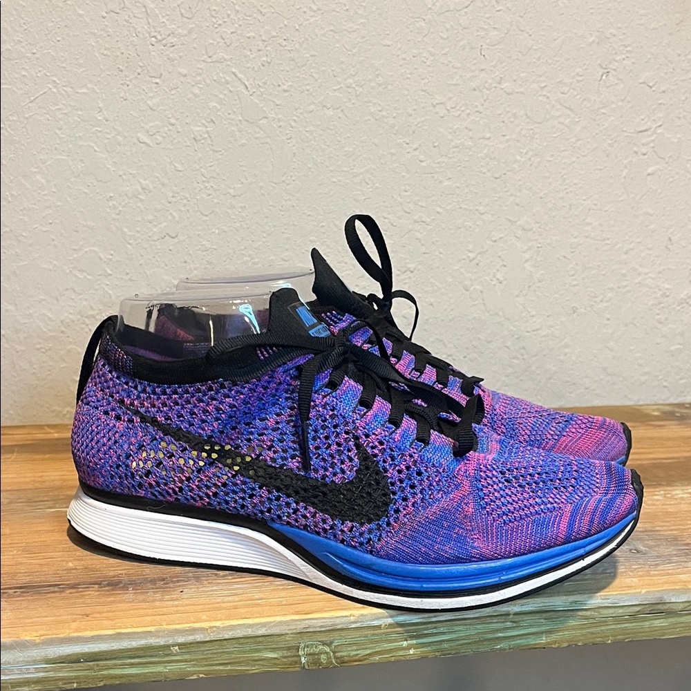 NWOB Nike Women’s Flyknit Racer in a Game Royal and Pink Flash colorway size 7